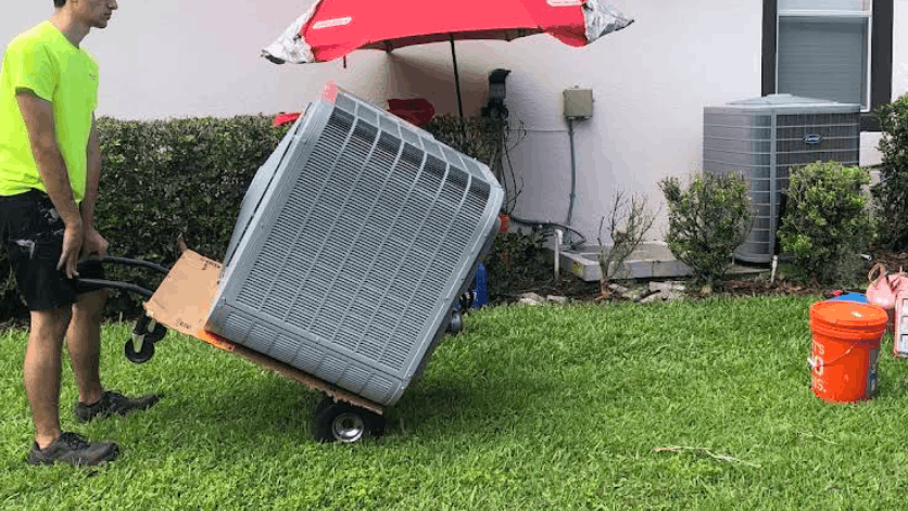Technician replacing AC in Hialeah home