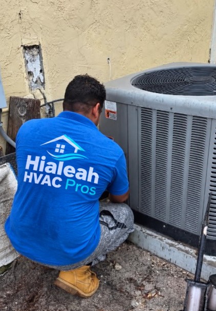 technician repairing ac in hialeah
